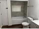 Updated bathroom with modern bathtub, fixtures, vanity, and vinyl flooring at 2523 Hood Nw Ave, Atlanta, GA 30318