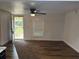 Bright living room with a ceiling fan and a large window to welcome natural light at 2523 Hood Nw Ave, Atlanta, GA 30318