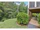 Landscaped backyard featuring a covered patio, stairs to an upper deck and lush greenery at 4062 Vinings Mill Se Trl, Smyrna, GA 30080