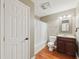 Well-lit bathroom features a cherry vanity, framed mirror, and tile-lined shower and bathtub at 4062 Vinings Mill Se Trl, Smyrna, GA 30080
