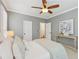 Cozy bedroom features a ceiling fan, neutral walls, soft carpeting, and generous natural light at 4062 Vinings Mill Se Trl, Smyrna, GA 30080
