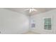 A bright, neutral bedroom featuring white trim and plantation shutters on two windows at 4062 Vinings Mill Se Trl, Smyrna, GA 30080