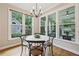 Sun-lit breakfast nook with hardwood floors and views of the outdoor spaces at 4062 Vinings Mill Se Trl, Smyrna, GA 30080