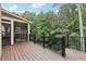 Wooden deck with adjacent screened porch offers plenty of outdoor living space at 4062 Vinings Mill Se Trl, Smyrna, GA 30080
