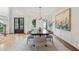 Bright dining area with modern chandelier and large windows overlooking the yard at 4062 Vinings Mill Se Trl, Smyrna, GA 30080