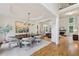 Elegant dining room with tray ceiling, wainscoting and views to the living room at 4062 Vinings Mill Se Trl, Smyrna, GA 30080