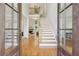 Grand entryway featuring an open staircase and views into the living spaces at 4062 Vinings Mill Se Trl, Smyrna, GA 30080