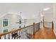 Open foyer featuring hardwood floors, high ceilings, and a view of the living space below at 4062 Vinings Mill Se Trl, Smyrna, GA 30080