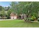 Traditional brick home with a two-car garage and a beautifully landscaped front yard at 4062 Vinings Mill Se Trl, Smyrna, GA 30080