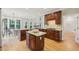 Open kitchen featuring granite counters, dark wood cabinetry, and island with seating at 4062 Vinings Mill Se Trl, Smyrna, GA 30080