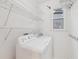Bright laundry room with washer/dryer hookups and convenient shelving for storage at 4062 Vinings Mill Se Trl, Smyrna, GA 30080