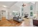 Spacious living room with high ceilings, fireplace, and abundant natural light at 4062 Vinings Mill Se Trl, Smyrna, GA 30080
