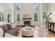 Cozy living room features a fireplace, abundant windows and comfortable seating at 4062 Vinings Mill Se Trl, Smyrna, GA 30080