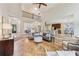Open-concept living area with herringbone floors and view to the dining and kitchen at 4062 Vinings Mill Se Trl, Smyrna, GA 30080