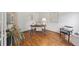 Well-lit home office with hardwood floors, desk, chair and natural decor at 4062 Vinings Mill Se Trl, Smyrna, GA 30080
