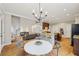 Open-concept layout with kitchen island, breakfast bar, dining area and living room at 4062 Vinings Mill Se Trl, Smyrna, GA 30080