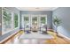 Inviting sitting room with lots of windows, hardwood floors and natural light overlooking the backyard at 4062 Vinings Mill Se Trl, Smyrna, GA 30080