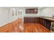 Basement wet bar with wooden cabinets, granite countertop, sink, and wine refrigerator at 4062 Vinings Mill Se Trl, Smyrna, GA 30080