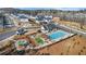 A beautiful aerial view of a community with a pool, playground, and well-maintained landscaping at 784 Keystone Dr, Woodstock, GA 30188