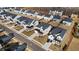 Aerial view of modern homes in a well-planned community with manicured lawns and tree-lined streets at 784 Keystone Dr, Woodstock, GA 30188