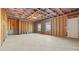 Unfinished basement is framed with wooden studs and has two windows at 784 Keystone Dr, Woodstock, GA 30188