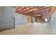 Spacious unfinished basement featuring concrete walls and floors, and exposed ceiling framework at 784 Keystone Dr, Woodstock, GA 30188