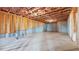 Unfinished basement with concrete floor, pink insulation, and wood framing ready for customization at 784 Keystone Dr, Woodstock, GA 30188