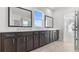 A bathroom features a modern vanity with dual sinks and large mirrors at 784 Keystone Dr, Woodstock, GA 30188