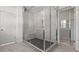 A glass enclosed shower has tiled walls and floors at 784 Keystone Dr, Woodstock, GA 30188