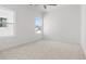 Bright bedroom featuring two windows and carpeted flooring at 784 Keystone Dr, Woodstock, GA 30188
