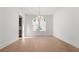 Formal dining room with hardwood floors and chandelier at 784 Keystone Dr, Woodstock, GA 30188