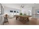 Spacious game room with pool table, accent seating, ceiling fan, and ample lighting at 784 Keystone Dr, Woodstock, GA 30188