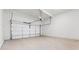 Clean, empty garage with a modern white door and smooth concrete floors, ready for use at 784 Keystone Dr, Woodstock, GA 30188