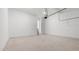 Bright garage with smooth concrete flooring and an entrance to the main house at 784 Keystone Dr, Woodstock, GA 30188