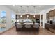 Modern kitchen with center island, stainless steel appliances, pendant lighting, and ample cabinet space at 784 Keystone Dr, Woodstock, GA 30188