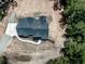 Aerial view of a house under construction with a dark roof and a gravel driveway at 1170 Upper Sweetwater Se Trl, White, GA 30184