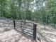 Exterior of fenced animal pen with goats in a wooded backyard at 1170 Upper Sweetwater Se Trl, White, GA 30184