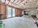 Unfinished basement featuring concrete floors, exposed ceiling, and walk-out doors to yard at 1170 Upper Sweetwater Se Trl, White, GA 30184