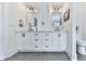 Bathroom showcasing a double vanity with modern mirrors and fixtures at 1170 Upper Sweetwater Se Trl, White, GA 30184