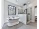 Modern bathroom featuring a freestanding tub and a glass-enclosed shower with stylish fixtures at 1170 Upper Sweetwater Se Trl, White, GA 30184