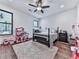 Inviting bedroom with a dark wood bed frame and plenty of natural light at 1170 Upper Sweetwater Se Trl, White, GA 30184