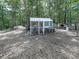 Exterior of a chicken coop in a wooded backyard at 1170 Upper Sweetwater Se Trl, White, GA 30184