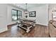 Cozy dining area with bench seating, hardwood floors, and modern lighting at 1170 Upper Sweetwater Se Trl, White, GA 30184