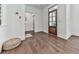 Stylish entryway with hardwood floors, white walls, and unique doorway at 1170 Upper Sweetwater Se Trl, White, GA 30184