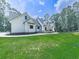 Elegant farmhouse featuring a manicured lawn, architectural design, and stylish features at 1170 Upper Sweetwater Se Trl, White, GA 30184