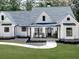 Charming white farmhouse with inviting porch and manicured lawn in a tranquil setting at 1170 Upper Sweetwater Se Trl, White, GA 30184