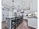 Modern kitchen featuring white cabinets, island with seating, and stainless steel appliances at 1170 Upper Sweetwater Se Trl, White, GA 30184