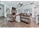 Bright living room with hardwood floors, fireplace, built-ins, and open layout at 1170 Upper Sweetwater Se Trl, White, GA 30184