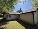 View of the backyard and side of the home featuring well maintained lawn at 5516 Westberry Ln, Norcross, GA 30071