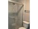 Bathroom featuring tile shower and toilet at 5516 Westberry Ln, Norcross, GA 30071